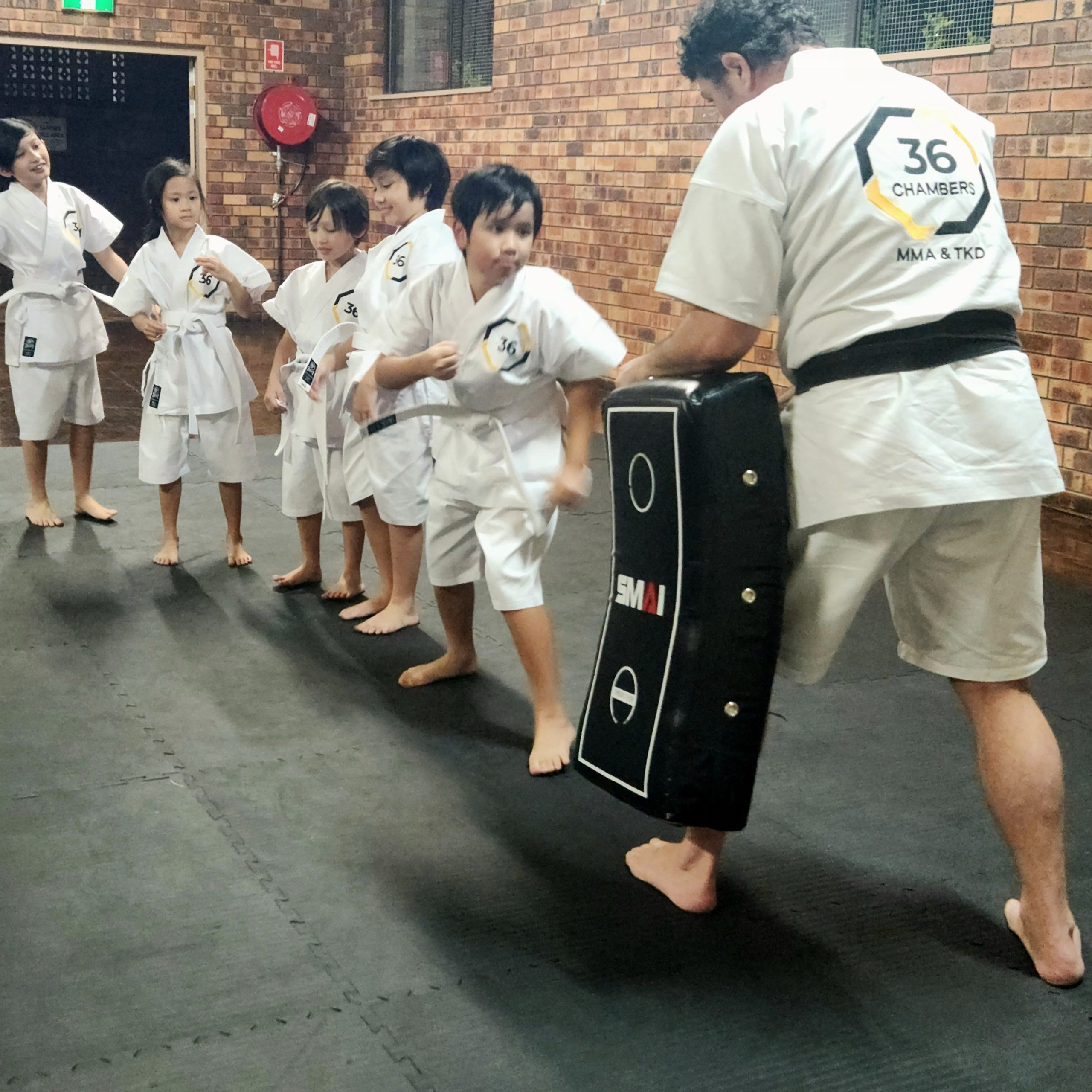 Kids taekwondo class in action